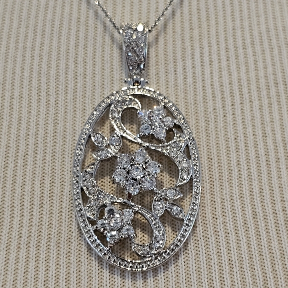 Unsigned Jewelry - Sterling silver oval pendant with CZ flowers & leaves on sterling chain